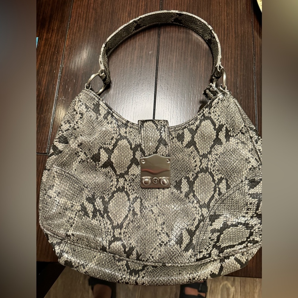 Gently used New York and company purse . Black and gray snake skin